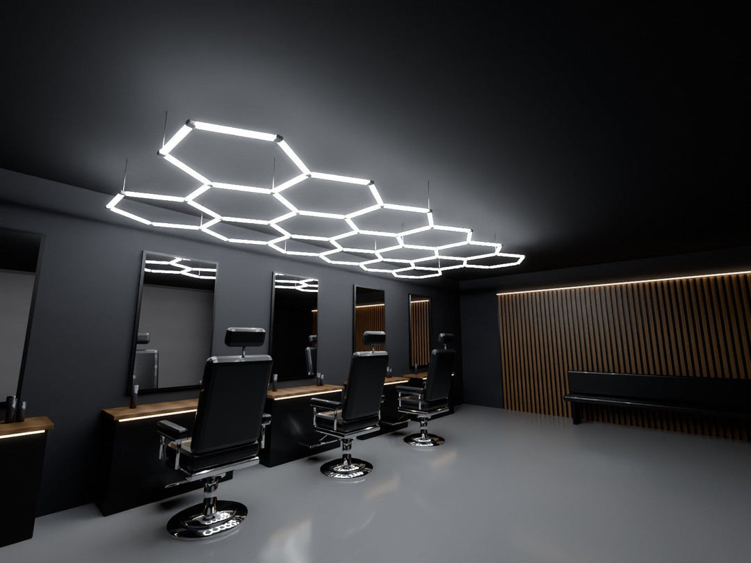 17 Grid hexagon LED light running along a row of three barber chairs and mirror stations