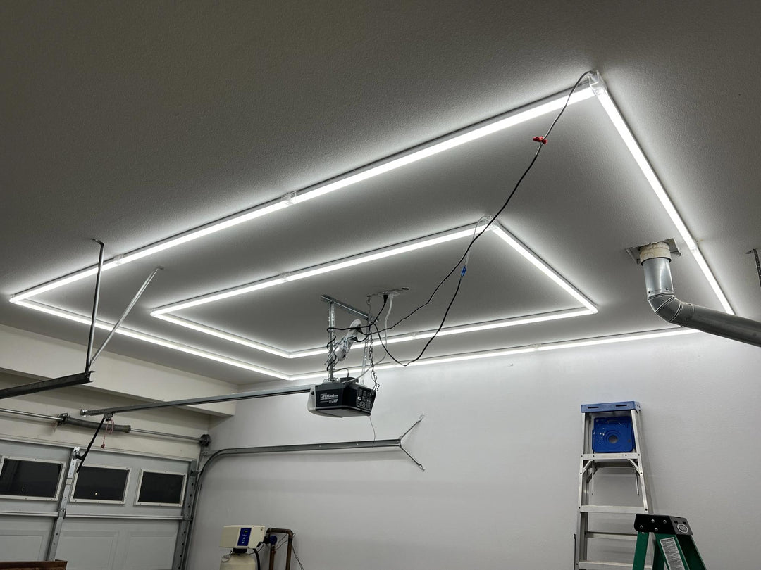 Two-frame linear grid light installed around a garage door opener with a ladder still in place