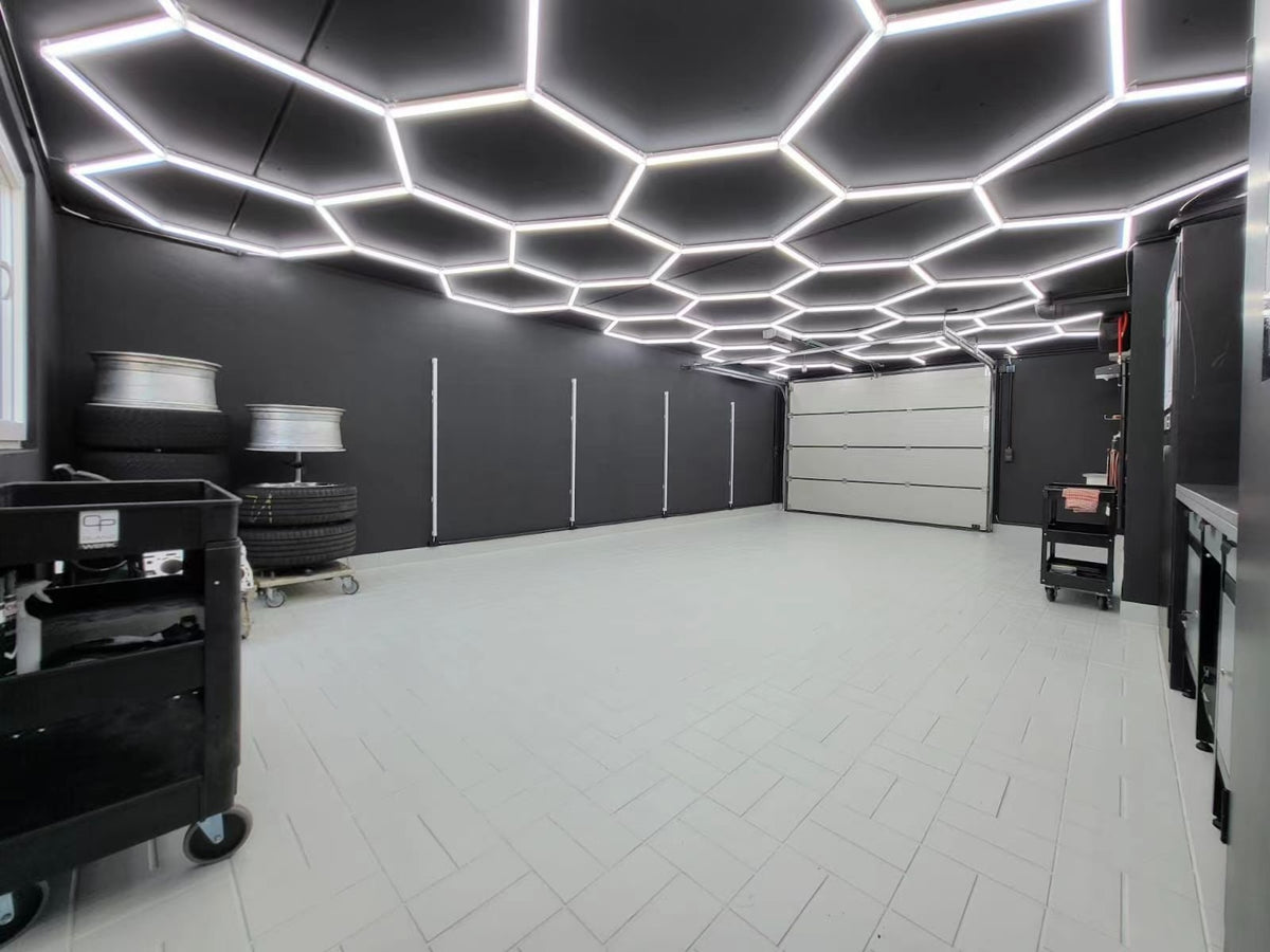 HEXLED 23-grid hexagon LED lights installed across a garage ceiling
