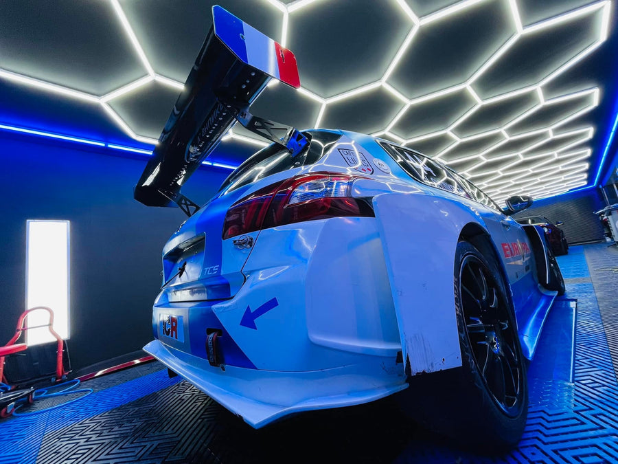 Motorsport Detailing Studio with custom hexagon LED lighting by HEXLED